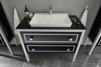 Puris Urfan Loft 128 см:  тумба, черная стеклянная столешница, ножки матовый хром и белая накладная раковина из мин литья, цвет мебели черное стекло